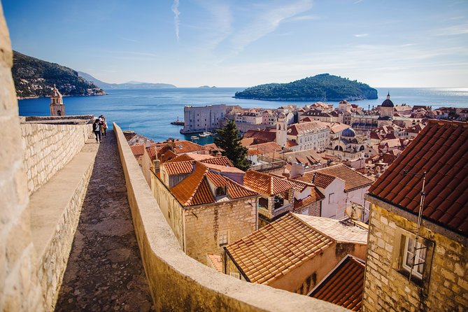 The Old Town roofs of Dubrovnik seen from the city walls, with the Adriatic beyond