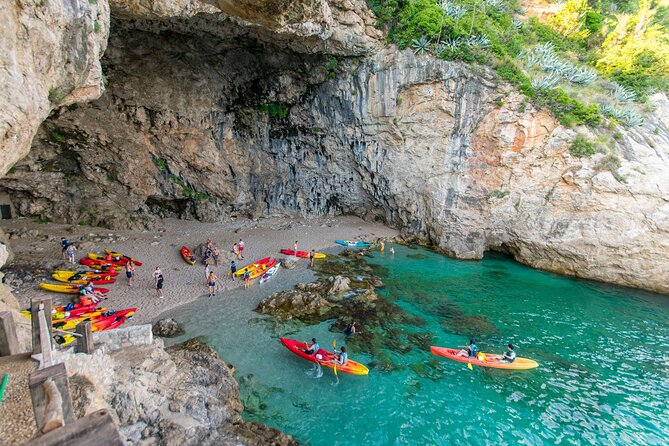 Dubrovnik Sea Kayaking Sunset Paddle - Betina Cave beach: snorkeling reefs, sunbathing views, and the cliff-jump reality