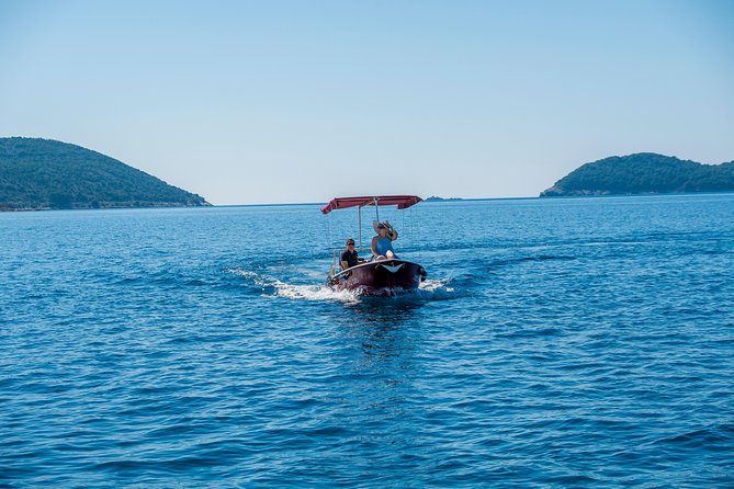 Rent a small boat without skipper - explore the islands and find hidden caves - The boat setup: shade, shade, and shade (plus snorkel-ready gear)